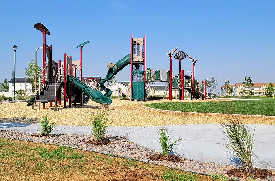 Commercial playground installation of swingset